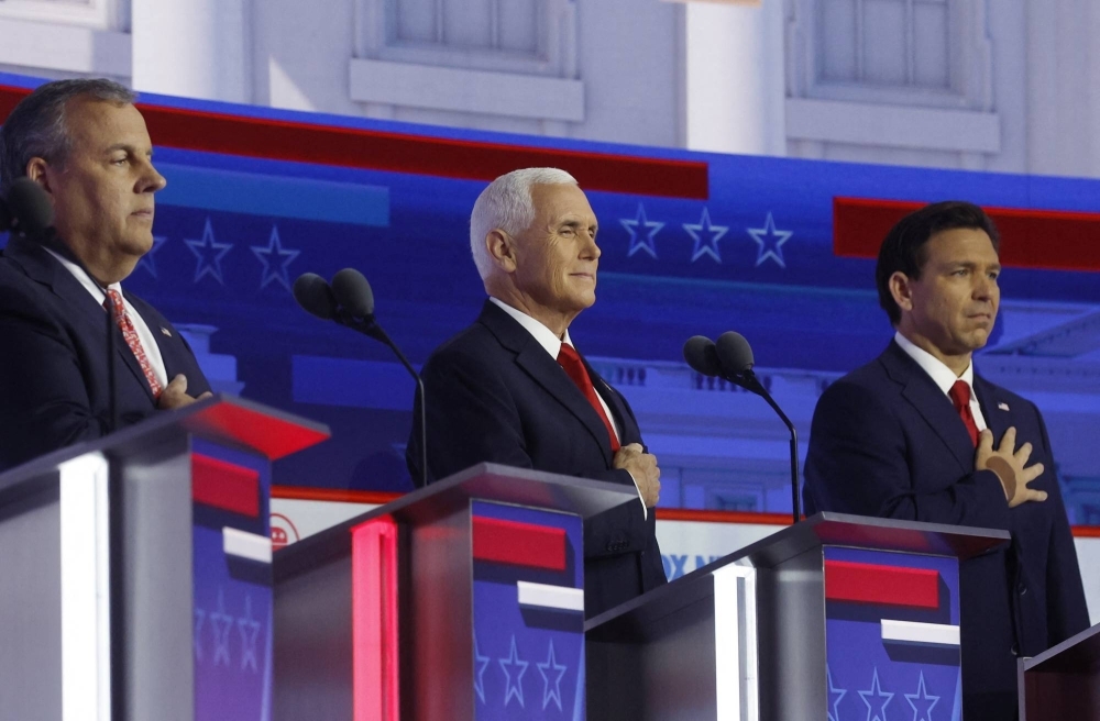 Former New Jersey Gov. Chris Christie (left), former U.S. Vice President Mike Pence (center) and Florida Gov. Ron DeSantis at the first debate between Republican candidates on Wednesday in Milwaukee, Wisconsin.