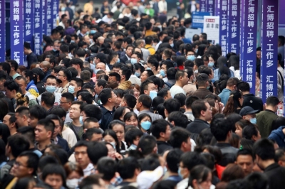 People attend a job fair in China's southwestern city of Chongqing on April 11. China on Aug. 15 said it would suspend the release of youth unemployment data, fueling data transparency concerns and heightening worries about the country’s economic slowdown.