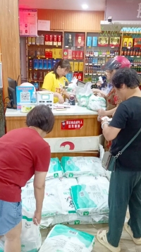People buy salt in Daoxian, China, in this screenshot obtained from a social media video released on Friday.  | REUTERS