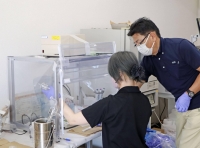 Scientists study fish caught near the location where treated radioactive water from the Fukushima No. 1 nuclear plant is being discharged into the ocean.  | Kyodo 