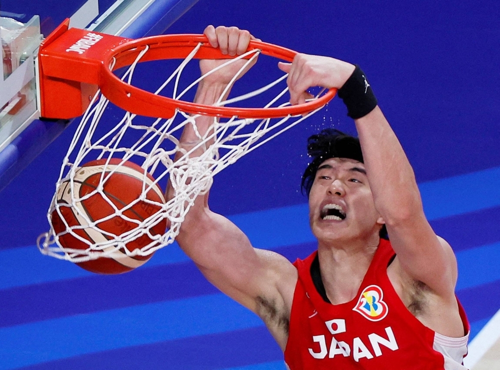 Japan's Yuta Watanabe scores two of his 20 points during the team's group stage loss to Germany on Friday in Okinawa. 