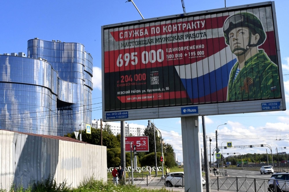 A billboard promoting contract army service in front of the Private Military Company Wagner Center in St. Petersburg on Saturday. 