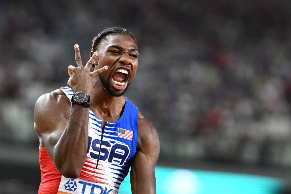 Noah Lyles celebrates after the U.S. won the men's 4x100 meter relay final at the World Athletics Championships in Budapest on Saturday. 