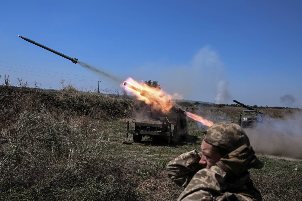 Ukrainian servicemen fire small multiple launch rocket systems toward Russian troops near a front line in Zaporizhzhia region, Ukraine, on Aug. 19.