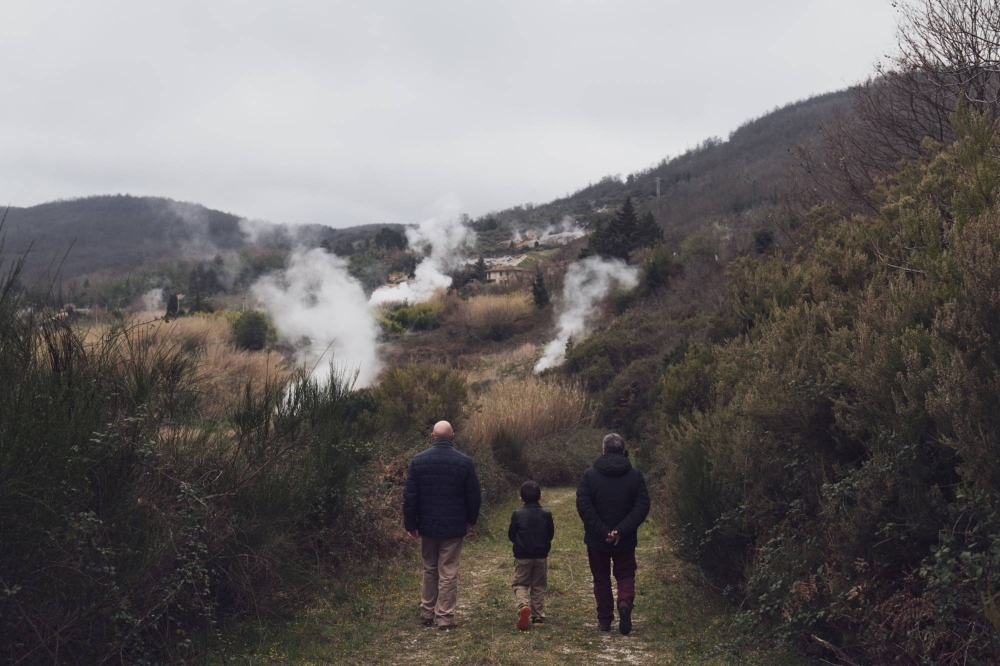 Visitors walk around natural geothermal manifestations at Furmarole park in Sasso Pisano, Italy.