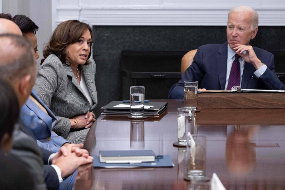 U.S. President Joe Biden looks on as Vice President Kamala Harris speaks during a meeting at the White House in Washington on Monday.