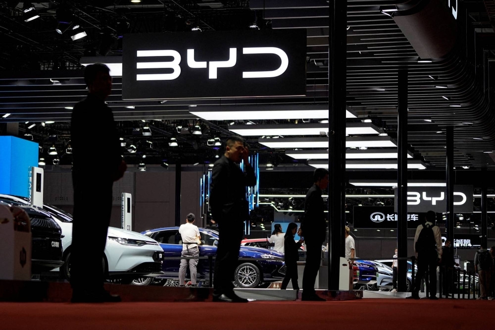Security personnel guard the BYD booth at the Auto Shanghai show in April 2023.