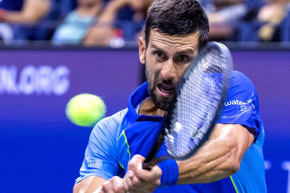 Serbia's Novak Djokovic plays a backhand return against France's Alexandre Muller during the U.S. Open tennis tournament men's singles first round match in New York on Monday.