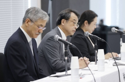 Former Prosecutor-General Makoto Hayashi (center) and two other experts speak about their investigation into Johnny Kitagawa's sexual abuse allegations, in Tokyo on Tuesday.