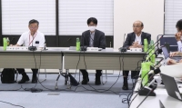 A health ministry panel of experts discuss their approval for an RSV vaccine during their meeting on Monday. | Kyodo