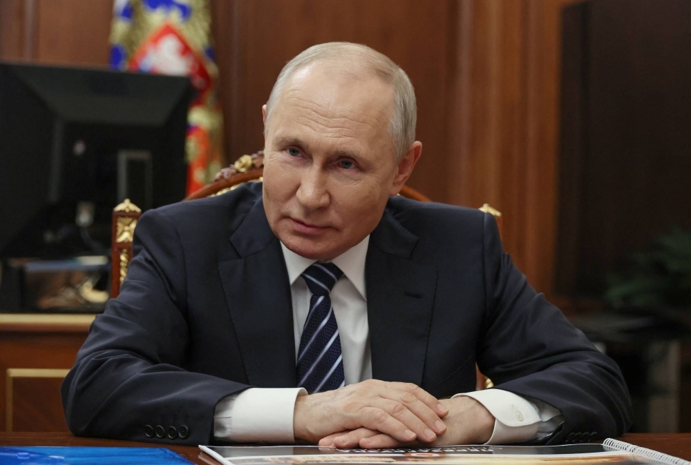 Russian President Vladimir Putin attends a meeting at the Kremlin in Moscow on Monday.