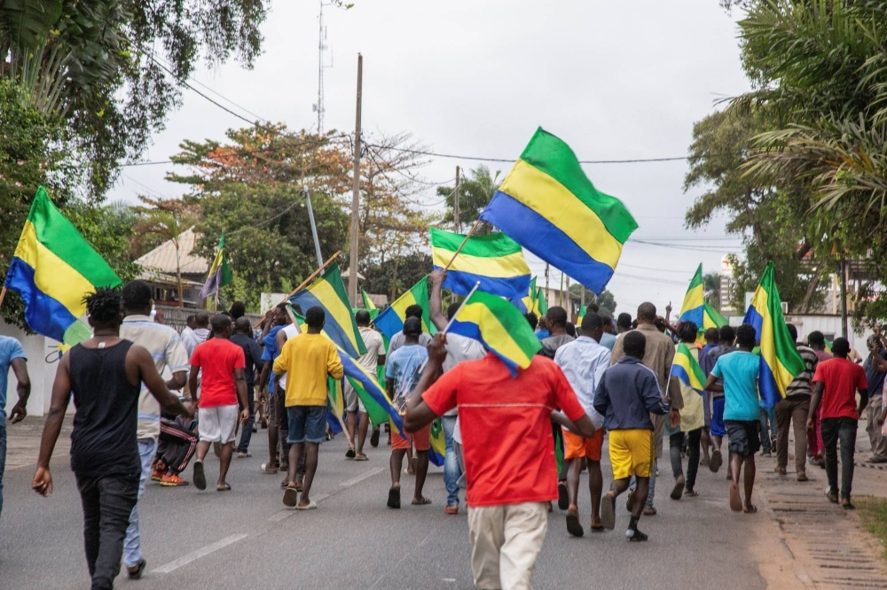People celebrate in support of a military coup, in a street in Port-Gentil, Gabon, on Wednesday.
