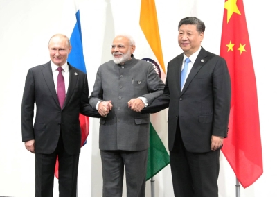 Russian President Vladimir Putin (left), Indian Prime Minister Narendra Modi (center) and Chinese President Xi Jinping pose for a picture during a meeting on the sidelines of the G20 summit in Osaka on June 28, 2019.