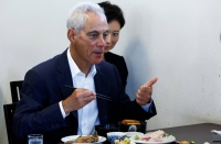 U.S. Ambassador to Japan Rahm Emanuel after eating fish during his visit to Soma, Fukushima Prefecture, on Thursday | Reuters