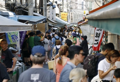 Visitors at the Tsukiji Outer Market in Tokyo on Aug. 25