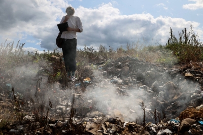 Environmental activist Yakov Demidov inspects a landfill on the outskirts of Penza, Russia.