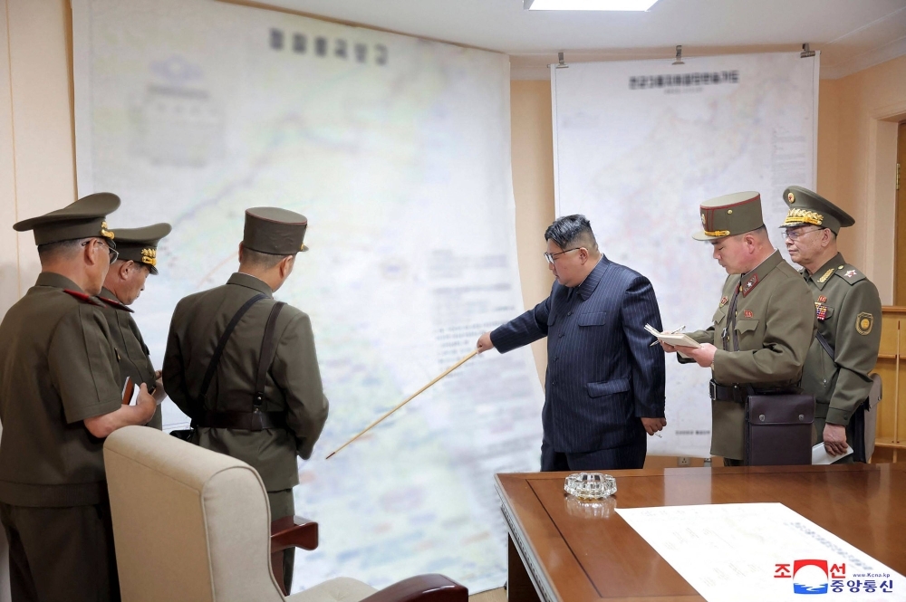 North Korean leader Kim Jong Un visits the training command post of the General Staff of the Korean People's Army at an undisclosed location in North Korea in this photo released Thursday.