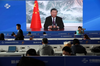Chinese leader Xi Jinping is seen on a screen during a video address for the Global Trade in Services Summit, at the media center for the China International Fair for Trade in Services in Beijing on Saturday.