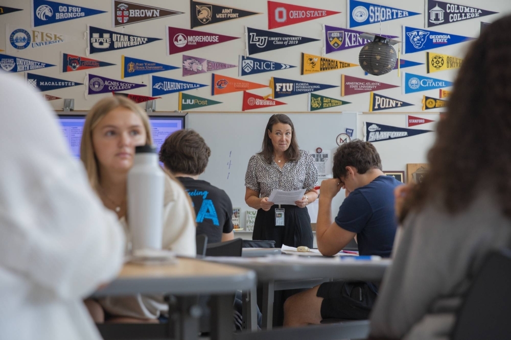 Susan Barber, an AP English teacher at Atlanta's Midtown High School, in class Tuesday. Barber said using AI chatbots could make students' college essays too generic. 
