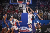 Yuki Kawamura drives to the basket at Okinawa Arena on Saturday. | AFP-JIJI