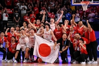 Members of team Japan celebrate their victory after their FIBA Basketball World Cup Group O match match with Cape Verde on Saturday. | AFP-JIJI