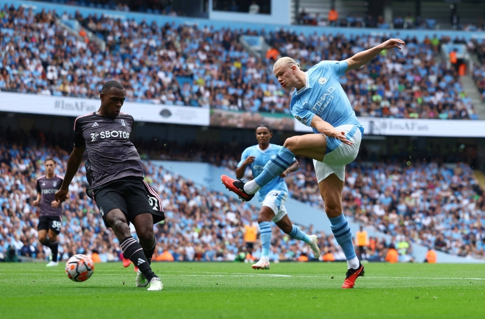 Manchester City's Erling Haaland (right) scored three goals during his team's over Fulham in Manchester, England, on Saturday.