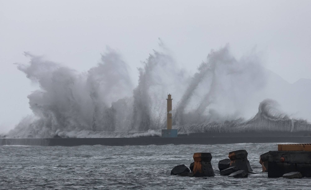 Huge waves pummel the city of Yilan as Typhoon Haikui makes landfall in eastern Taiwan on Sunday.