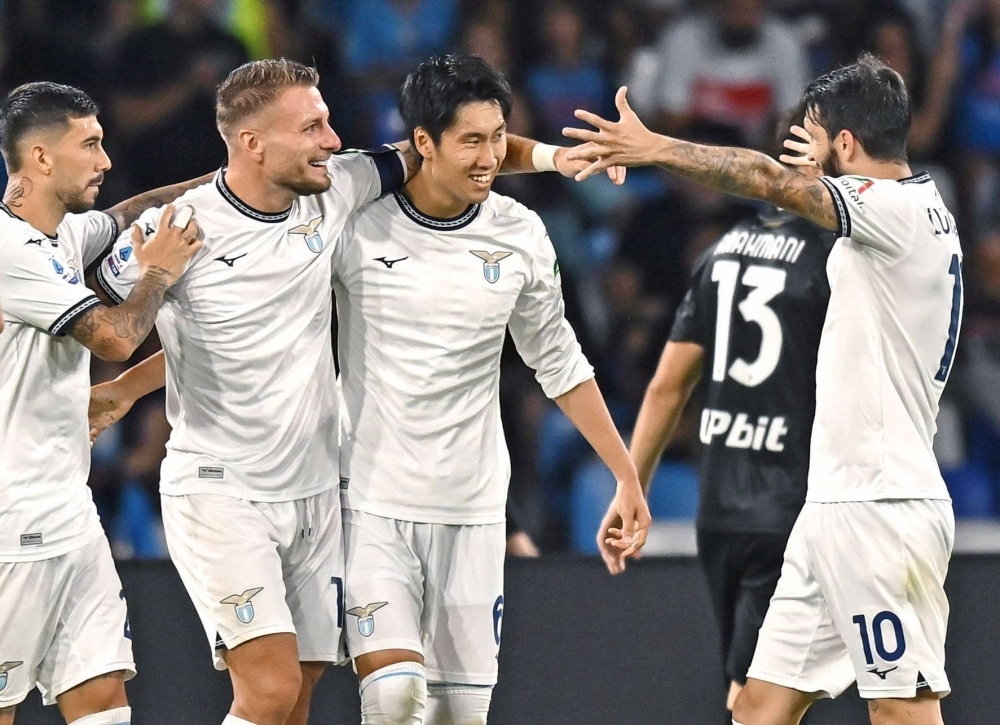 Lazio's Daichi Kamada (second from right) celebrates with his teammates during their match against Napoli in Naples on Sunday.