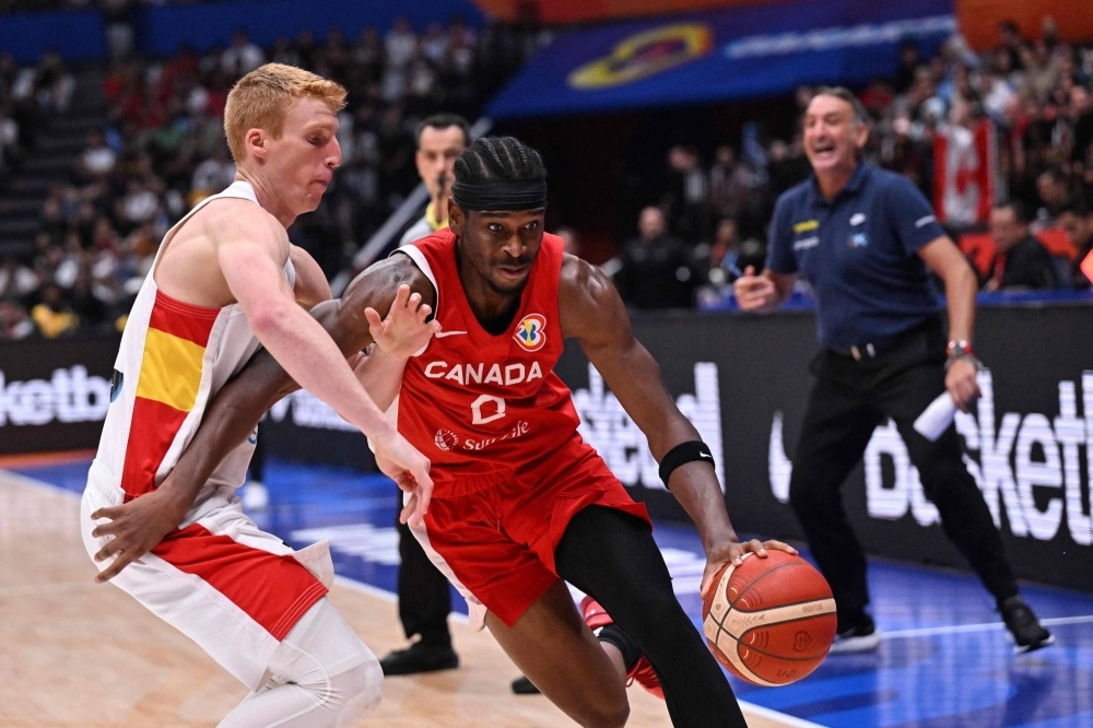 Canada's Shai Gilgeous-Alexander drives against Brazil's Alberto Diaz during their game at the Basketball World Cup in Jakarta on Sunday.