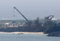 Construction work continues on Monday at the Henoko coastal area of Nago, Okinawa Prefecture. | Kyodo
