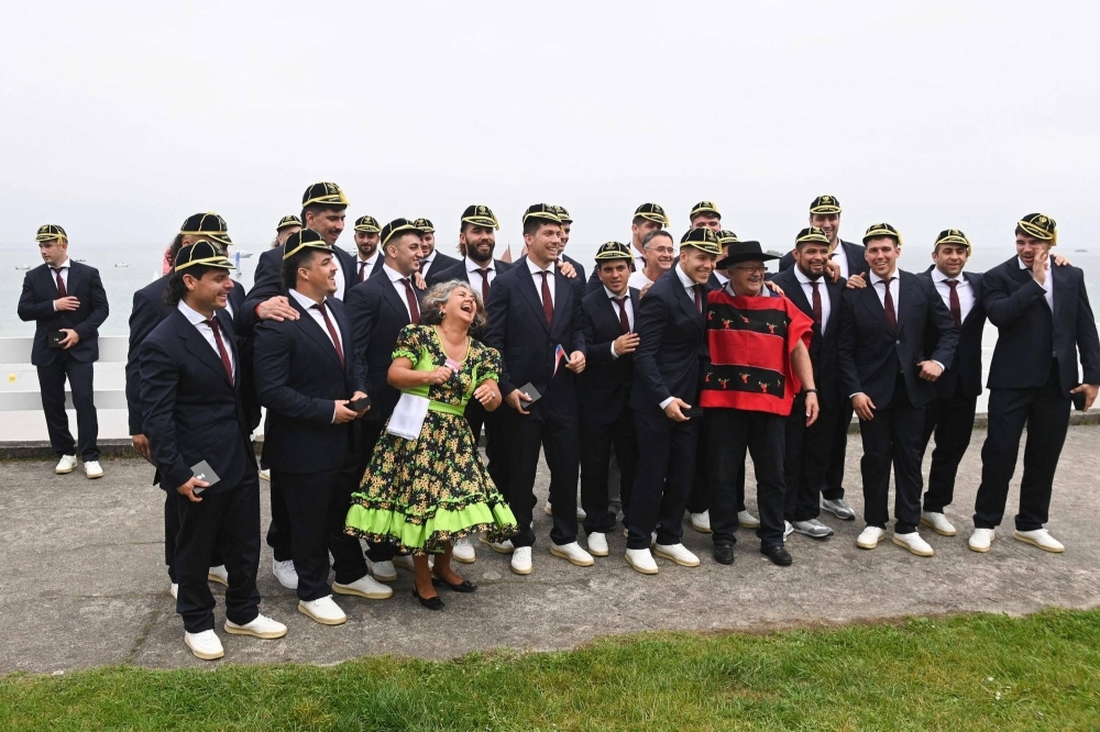 Chilean national rugby team players pose for a photograph with supporters during the team's welcoming ceremony at the convention centre in Perros-Guirec, France, on Sunday, ahead of the 2023 Rugby World Cup.