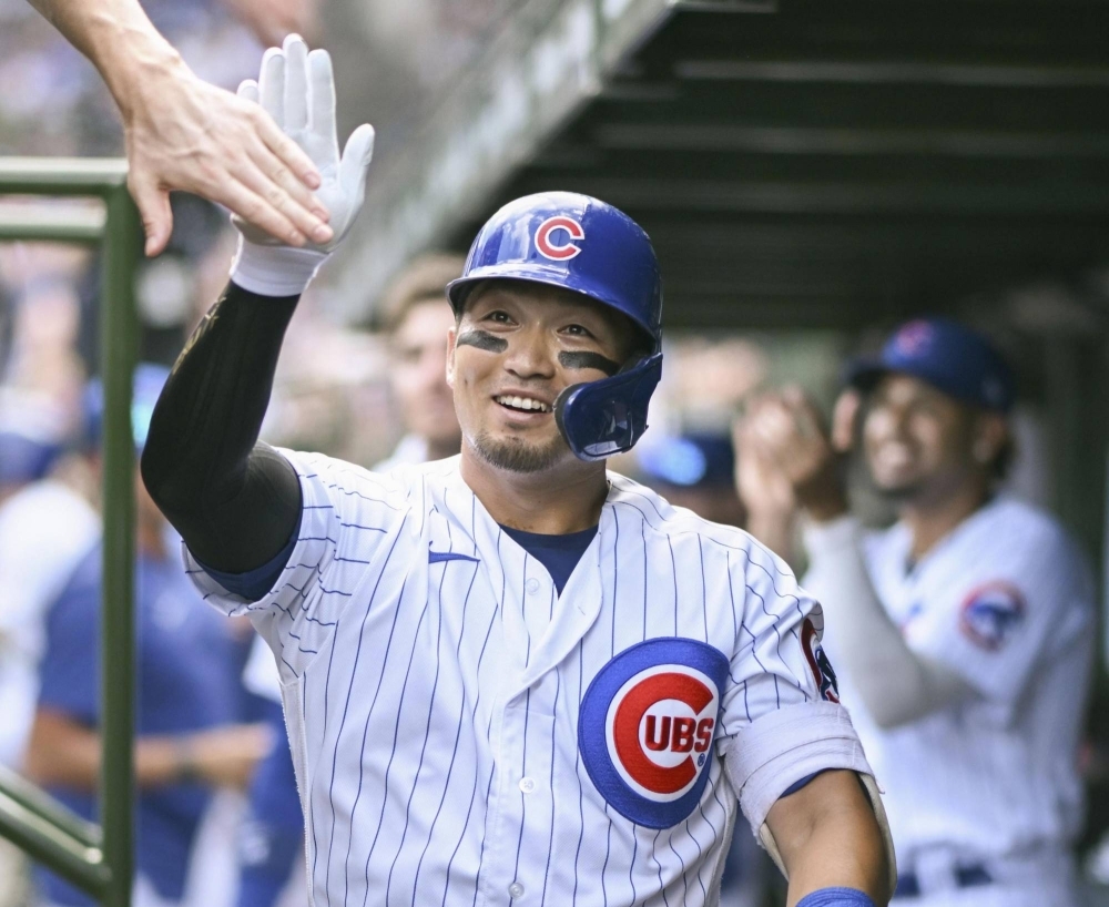 Seiya Suzuki of the Chicago Cubs celebrates after a home run in the second inning of a game against the San Francisco Giants at Wrigley Field on Monday in Chicago.