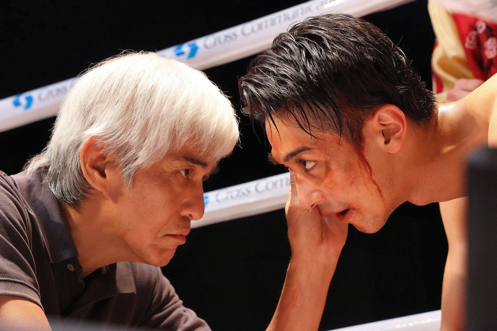 A former boxer (Koichi Sato, left) trying to restart his life in Japan takes on a young trainee (Ryusei Yokohama) with aspirations to win big in “One Last Bloom.”