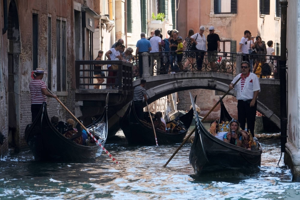 Tourists visit Venice as the municipality prepares to charge them up to 10 Euro for entry into the city in order to cut down the number of visitors.