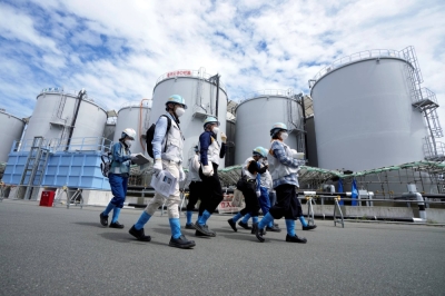 Journalists tour the Fukushima No. 1 nuclear power plant and the tanks that contain contaminated water on Aug. 27