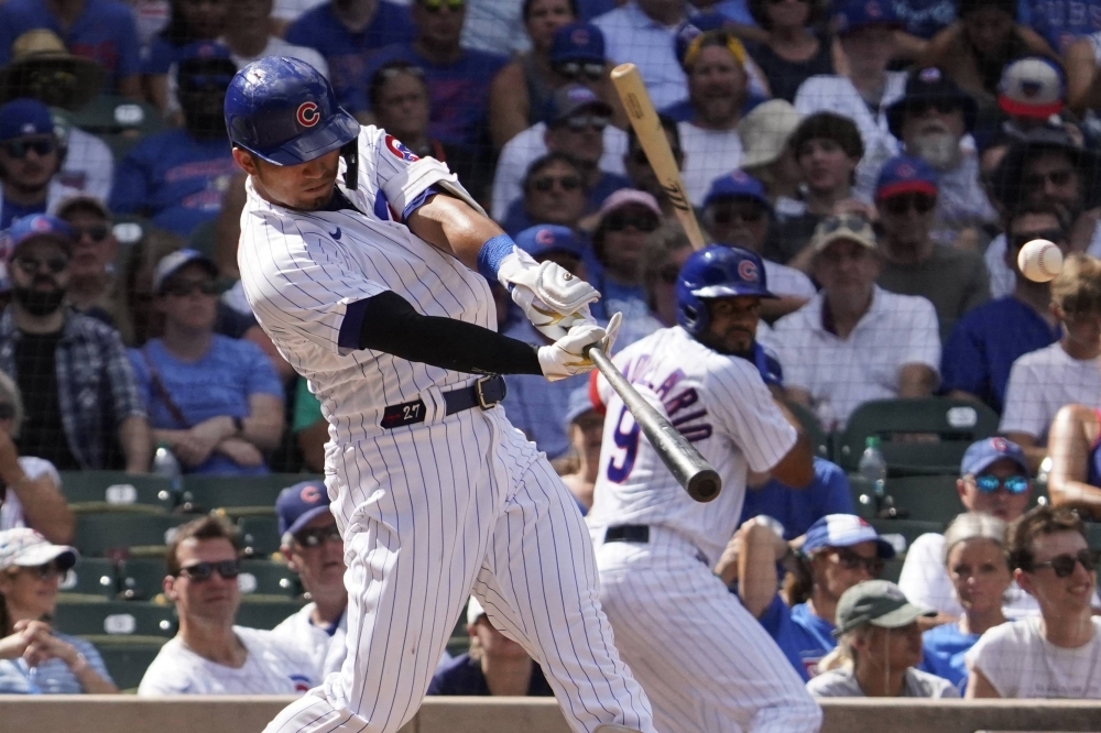 Chicago Cubs right fielder Seiya Suzuki hits a one run double against the San Francisco Giants during the seventh inning at Wrigley Field, Chicago, on Monday.