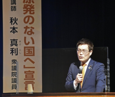 Lawmaker Masatoshi Akimoto makes a speech advocating for renewable energy, in Mito, Ibaraki Prefecture in March 2021.