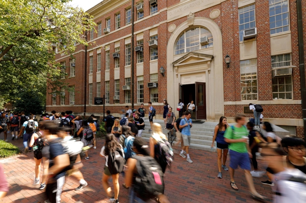 Students walk past a classroom building on the campus of the University of North Carolina at Chapel Hill, North Carolina.