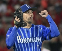 BayStars starter Katsuki Azuma recorded a complete-game victory against the Carp in Hiroshima on Thursday. | KYODO