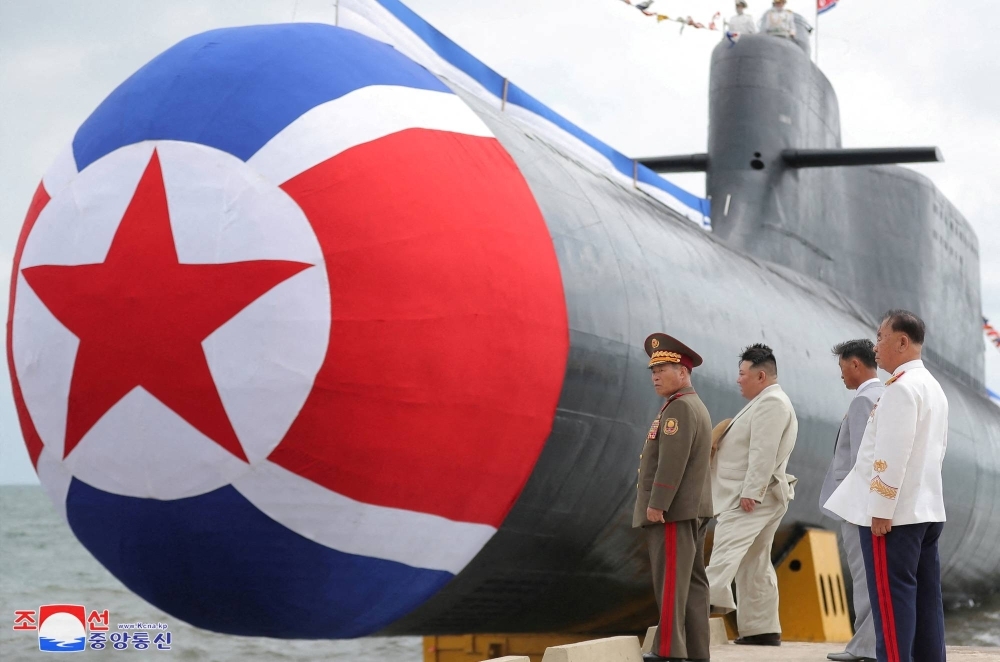 North Korean leader Kim Jong Un attends what state media report was a launching ceremony for a new tactical nuclear attack submarine in North Korea, in this picture released by North Korea's Korean Central News Agency on Friday.