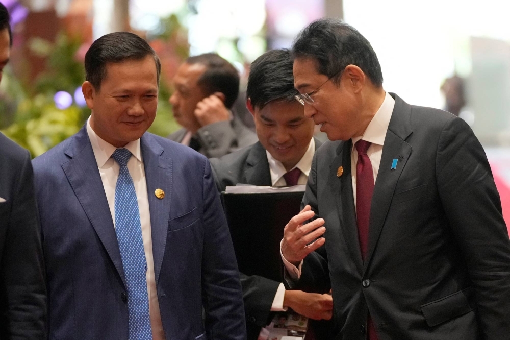 Prime Minster Fumio Kishida talks with his Cambodian counterpart, Hun Manet, as they arrive at the Association of the Southeast Asian Nations Summit in Jakarta on Thursday.