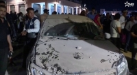 A car is covered in dust in the aftermath of an earthquake in Marrakech, Morocco, on Saturday in this screen shot taken from  video. | Al Oula TV / via REUTERS