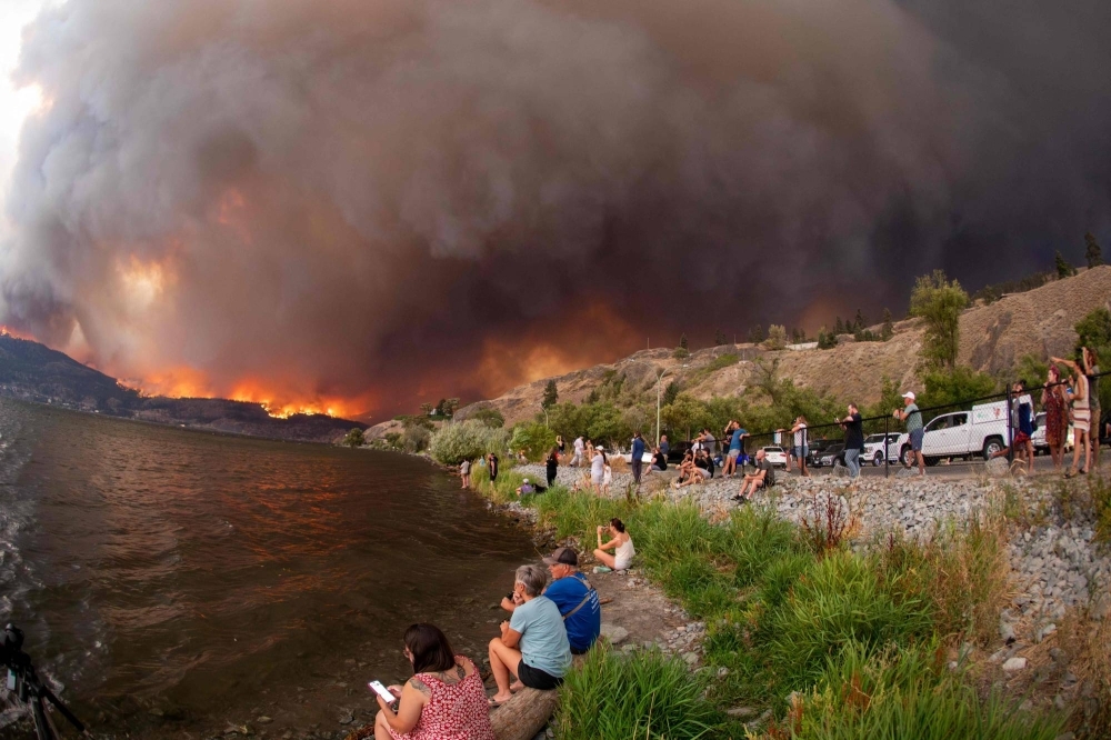 Residents watch the McDougall Creek wildfire in West Kelowna, British Columbia, Canada, last month.