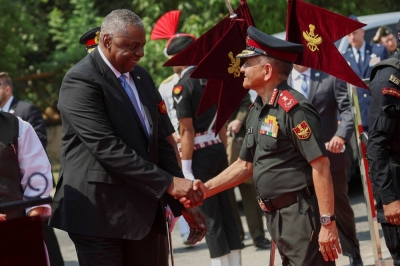 U.S. Secretary of Defense Lloyd Austin shakes hands with India's Defense chief Gen. Anil Chauhan during a reception in New Delhi in June.