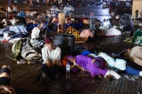 Residents take shelter outside at a square following a powerful earthquake in Marrakesh, Morocco, on Saturday. | AFP-JIJI