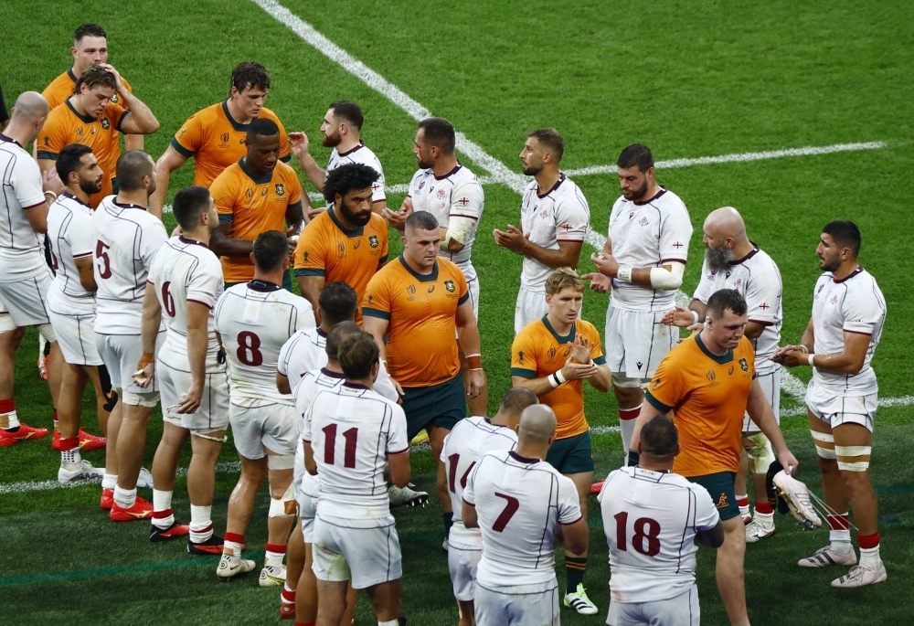 Georgia players form a guard of honor for the victorious Wallabies following their 2023 Rugby World Cup Pool C match outside Paris on Saturday.