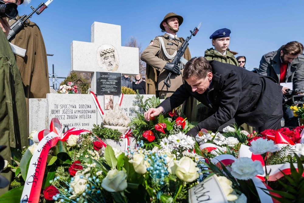 A ceremony is held in March 2016 in Markowa, Poland, at the grave of the Ulma family who were killed by the Nazis for hiding Jews during WWII. 