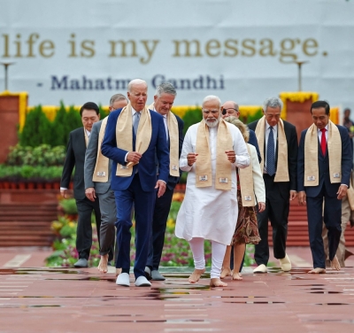 Indian Prime Minister Narendra Modi, U.S. President Joe Biden and other Group of 20 leaders arrive to pay their respects at the Mahatma Gandhi memorial in New Delhi on Sunday.