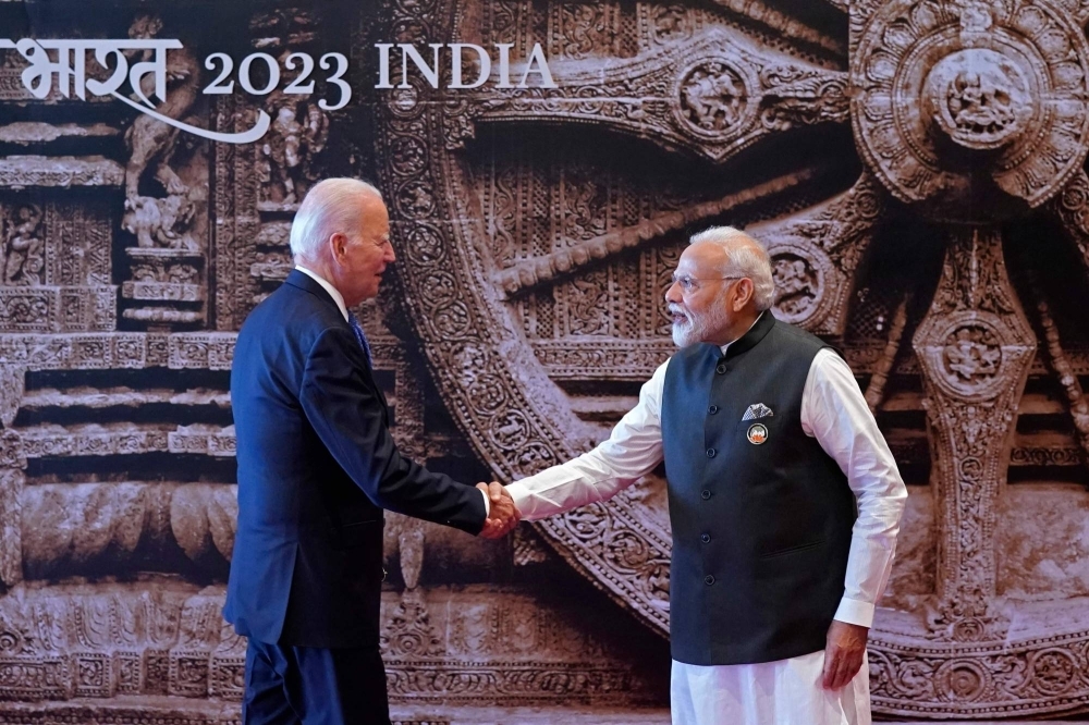 Indian Prime Minister Narendra Modi shakes hands with U.S. President Joe Biden upon his arrival at the Bharat Mandapam convention center for the Group of 20 summit in New Delhi on Saturday.