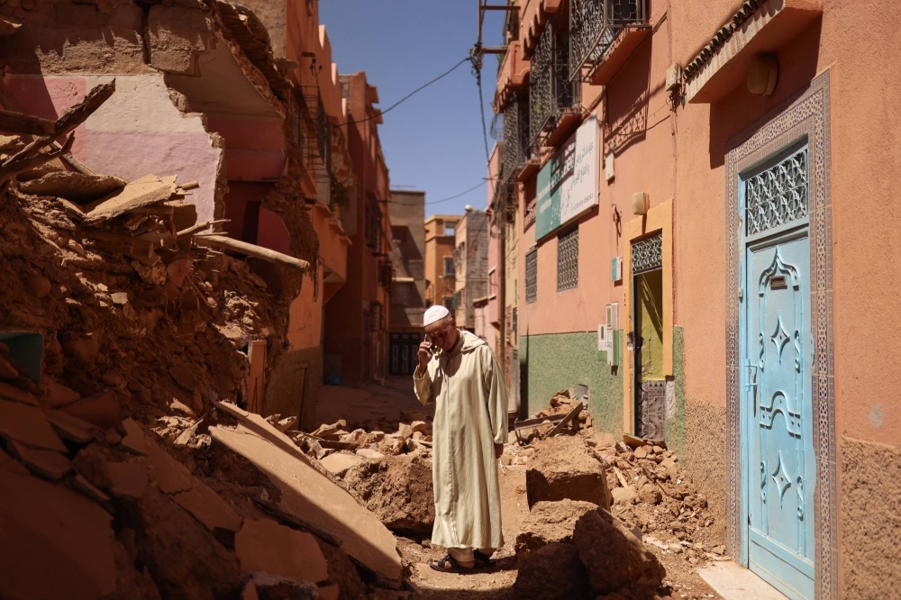 Mohamed Sebbagh, 66, stands in front of his destroyed house on Sunday, in the aftermath of a deadly earthquake, in Amizmiz, Morocco.